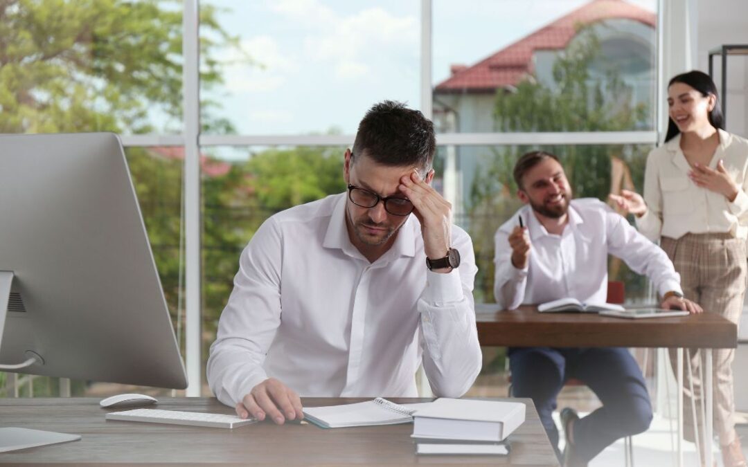 AST Cybersecurity Cyberbulling in the Workplace Essential Guide bullying a man in the workplace